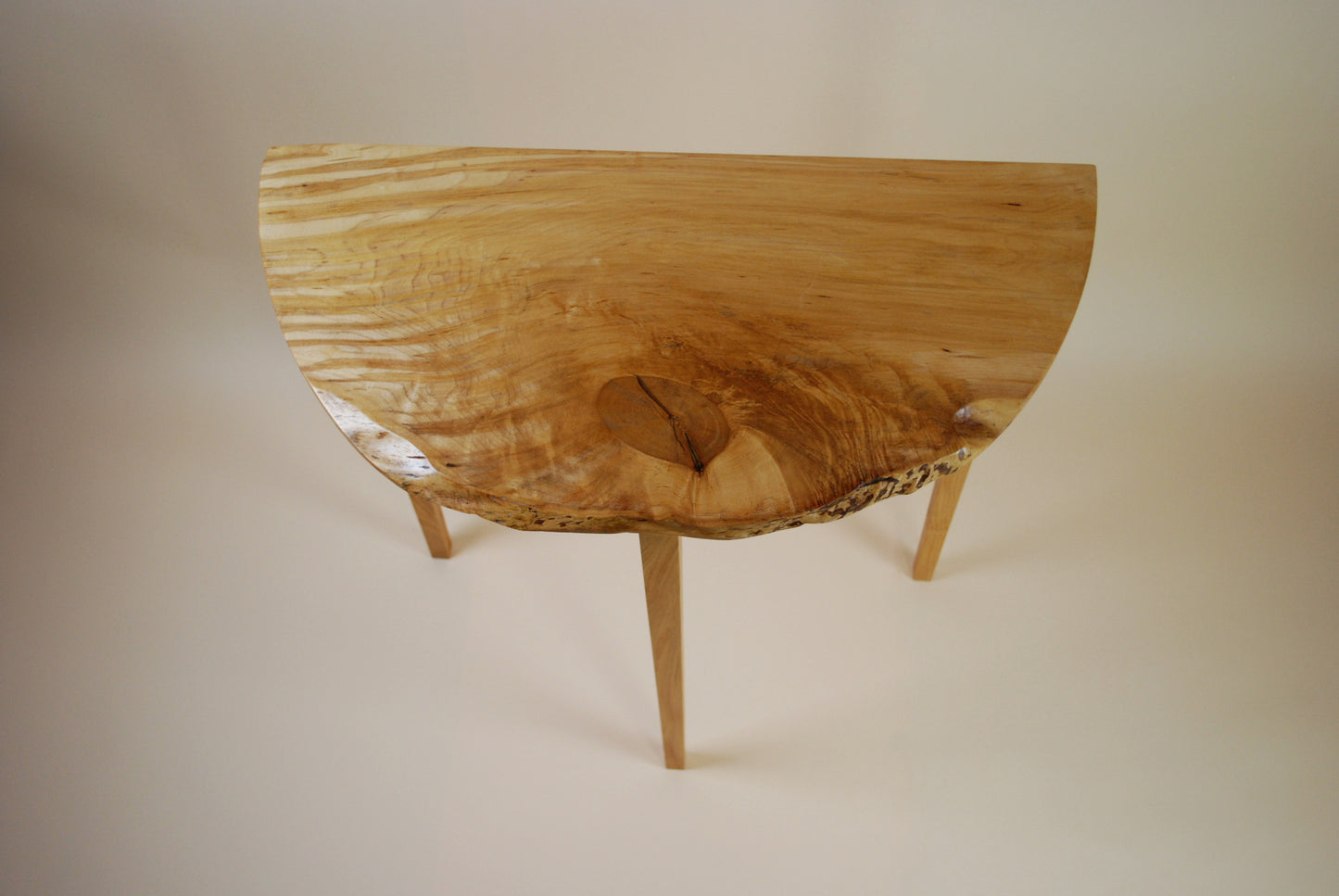 Figured Maple Round Front Three Legged Stand