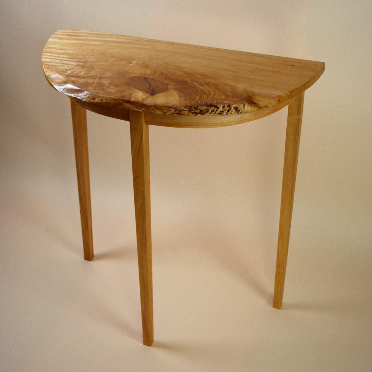 Figured Maple Round Front Three Legged Stand