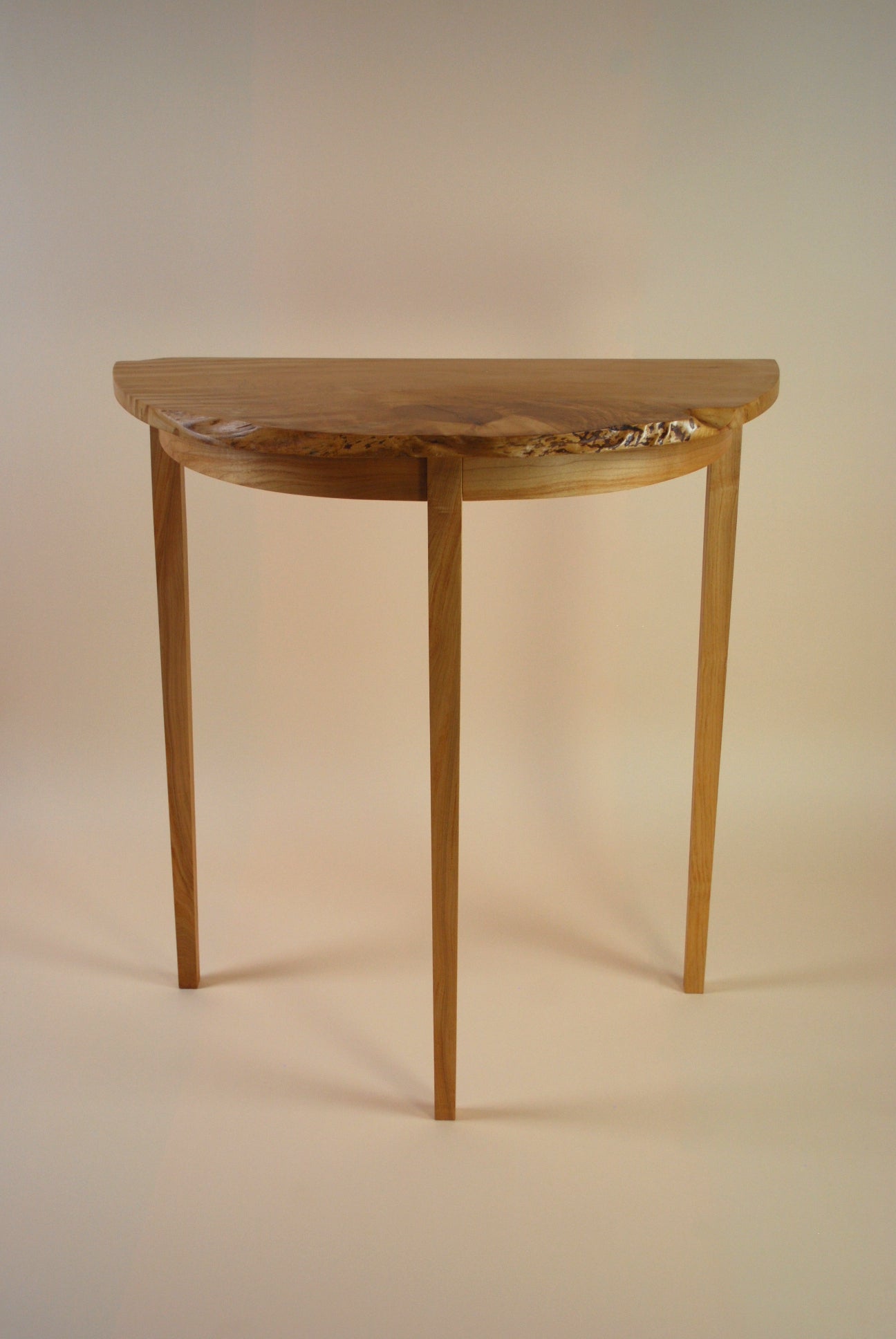 Figured Maple Round Front Three Legged Stand